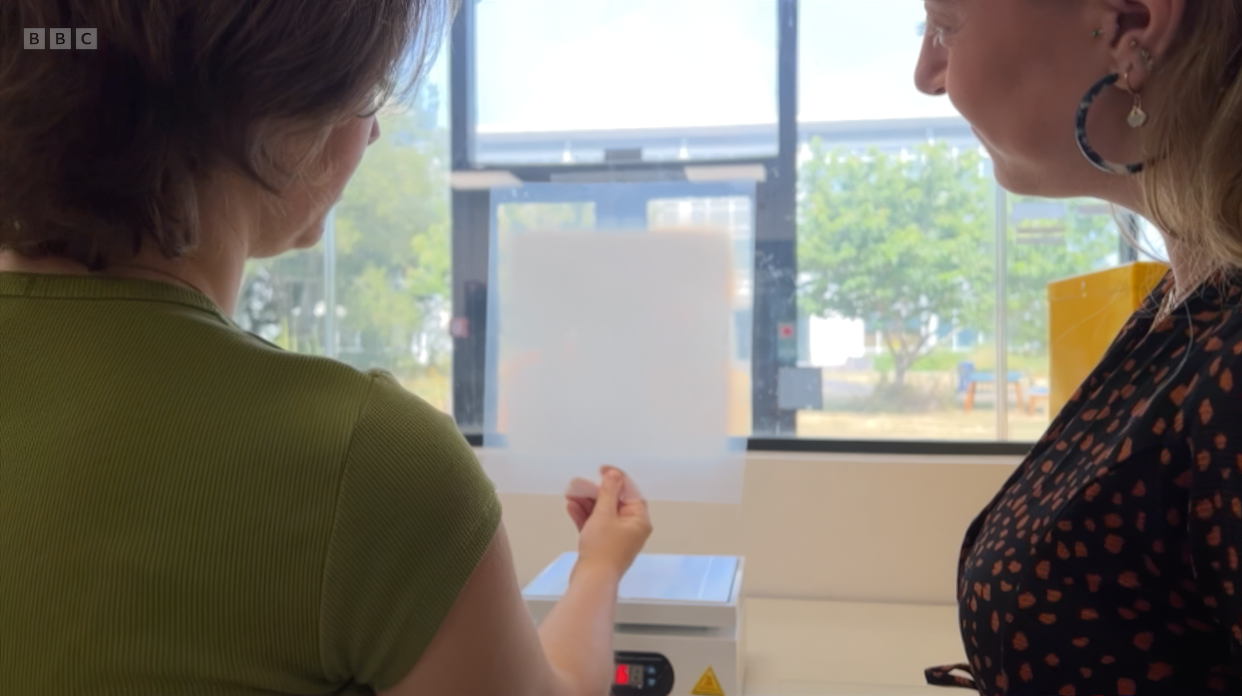 A pane treated with Albotherm’s heat-activated material turning white against a sunlit window
